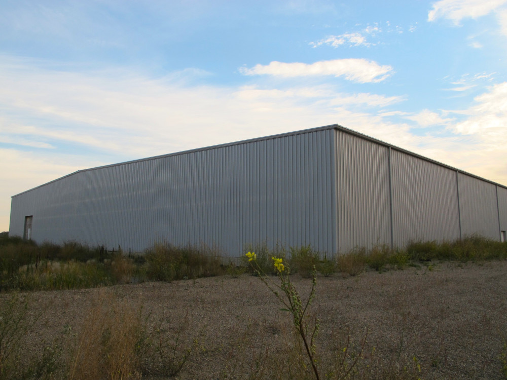WELL-LOCATED INDUSTRIAL BUILDING NEAR HWY 13 - ± 67,000 SF ON 23.36 AC